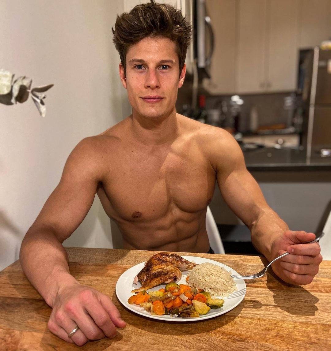 handsome-young-fit-shirtless-male-model-eating-healthy-food