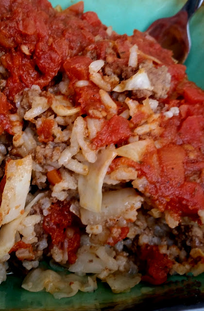 cabbage roll casserole in a bowl with a fork