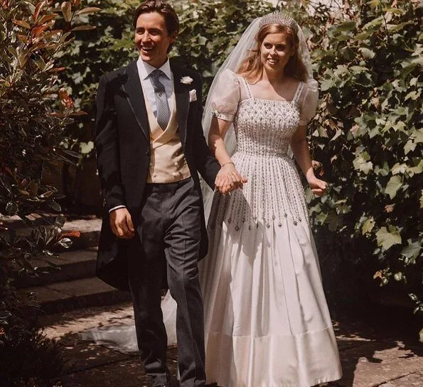 Princess Beatrice wore a vintage dress by Norman Hartnell and the Queen Mary diamond fringe tiara. Wedding of Princess Beatrice