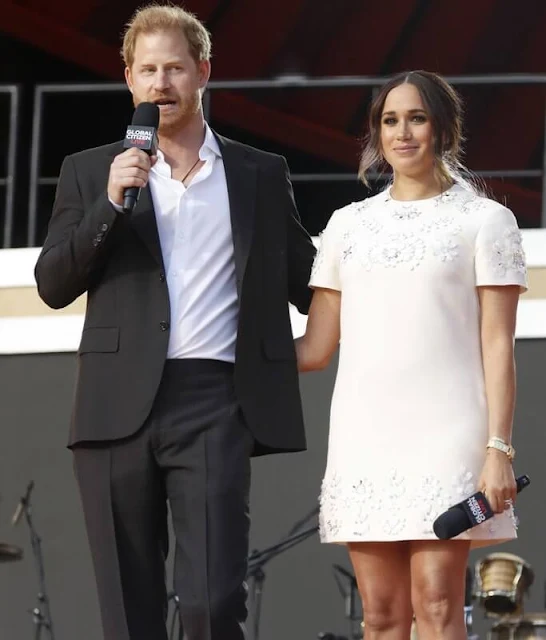 Meghan Markle wore a new floral-embellished mini shift dress by Valentino. Prince Harry