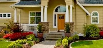 Home with beautiful fall landscaping  and curb appeal.