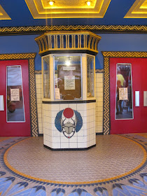 Box office in the foyer of a modern dolls' house miniature cinema.