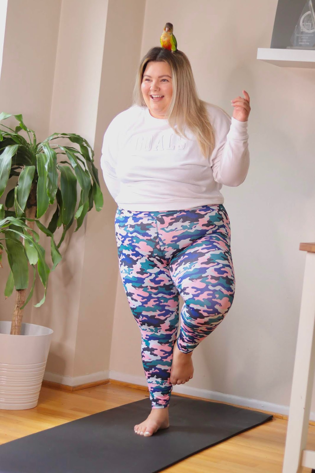 Chicago Plus Size Petite Fashion Blogger, influencer, YouTuber, and model Natalie Craig, of Natalie in the City, reviews Fabletics' powerhold leggings and yoga pants.