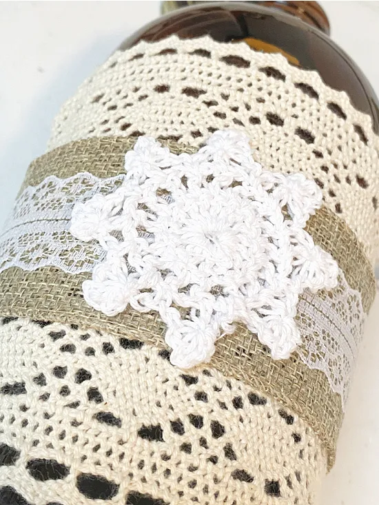 lace and doily wrapped around bottle