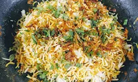 Topped rice with mint Cilantro and fried onions for restaurant style veg biryani recipe