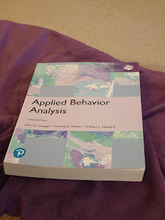 A book with the heading Applied Behavior Analysis - Third Edition