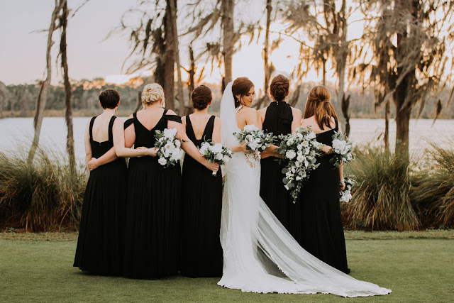 bride and bridesmaids in black dresses