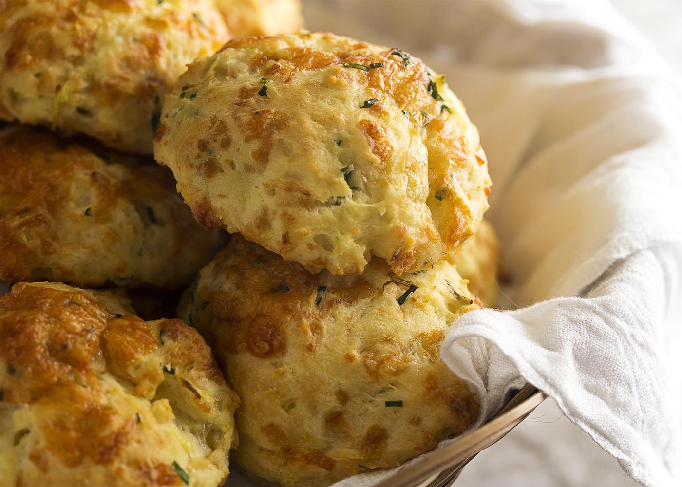 They are extra moist from the zucchini, tangy from the cheese and buttermilk, and have a little zing from the fresh herbs. These are drop biscuits taken to the next level! They are extra moist from the zucchini, tangy from the cheese and buttermilk, and have a little zing from the fresh herbs. These are drop biscuits taken to the next level!