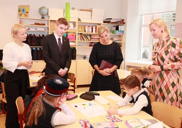 Prince Edward, Earl of Wessex and Sophie Countess of Wessex visited the Tallinn English College. Millington Wool Crepe Coat and wool dress