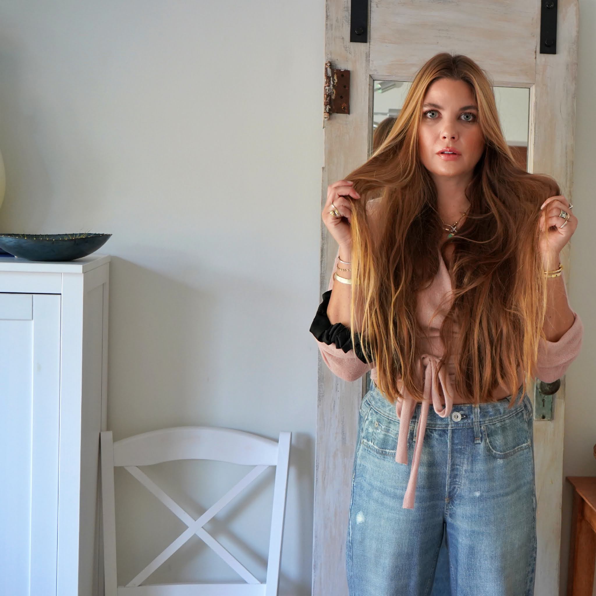 woman holding her hair