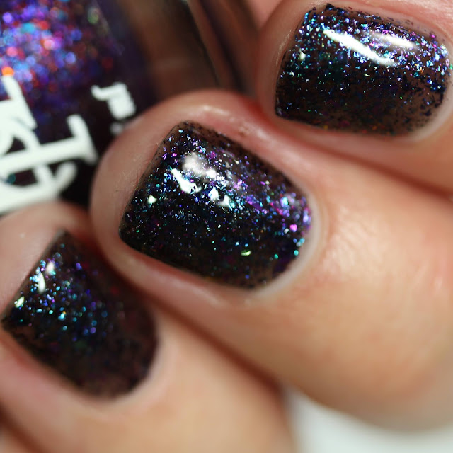 black nail polish with multi chrome flakes