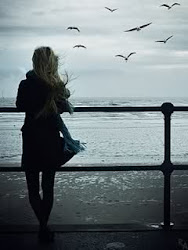 Sad Girl Picture Wallpaper on the beach Frames Collection