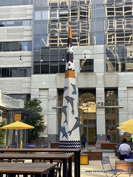 obelisk featuring dolphins by Berkeley artist Joan Brown at back of Rincon Center Annex on Commonwealth Club Waterfront tour in San Francisco, California