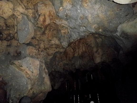 The interior of Jatijajar Cave with a rock ceiling.