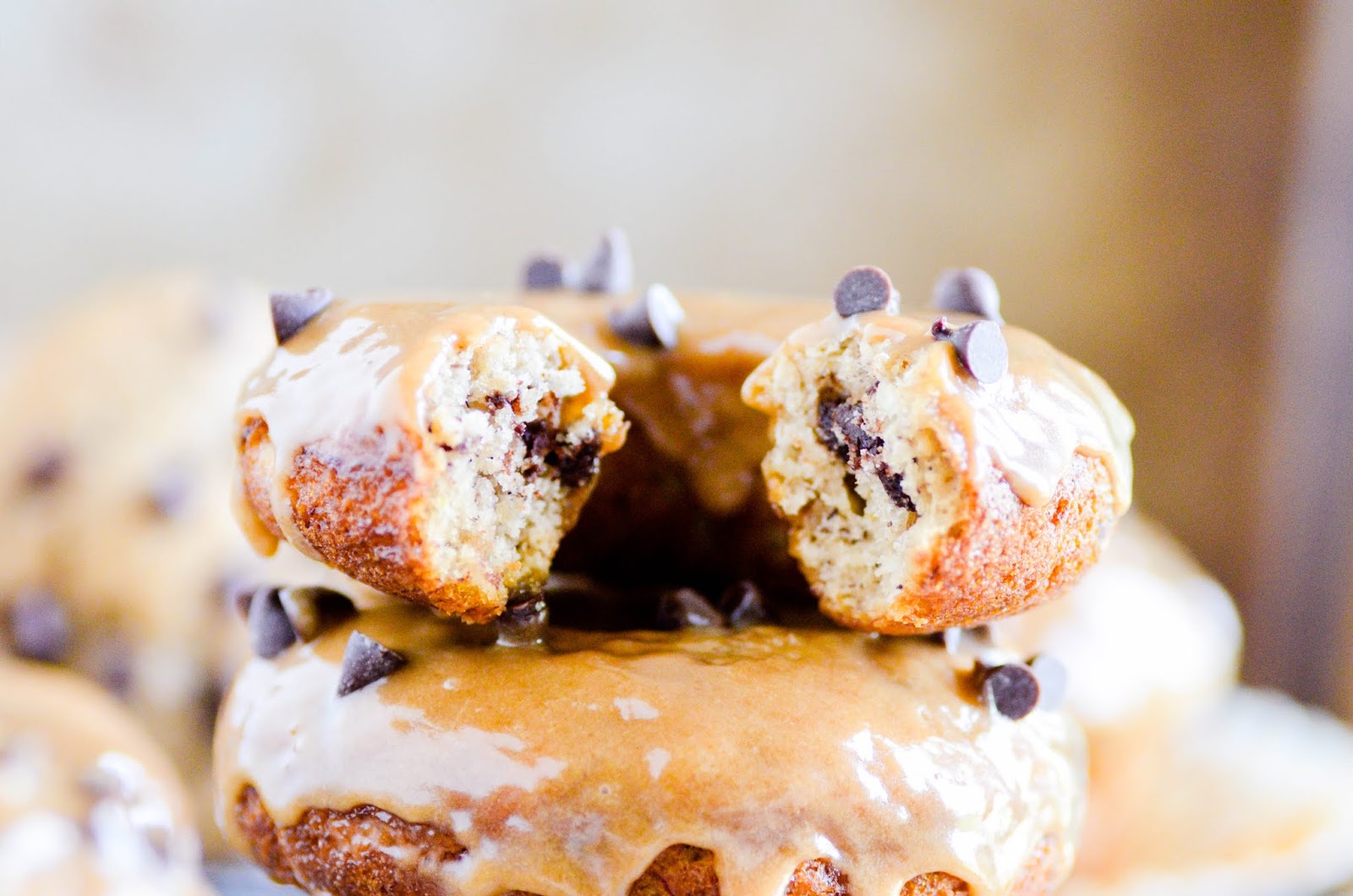 Our family favorite recipe for banana bread baked into donuts and topped with a Biscoff glaze!