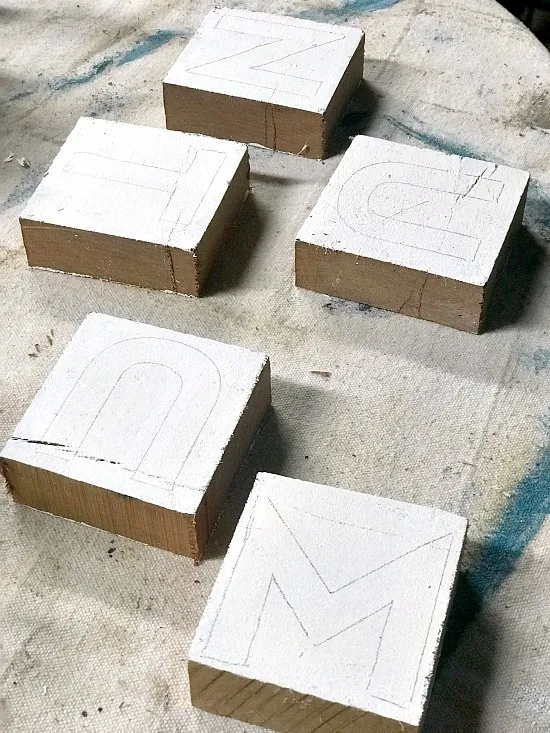 Pencil drawn letters on the blocks