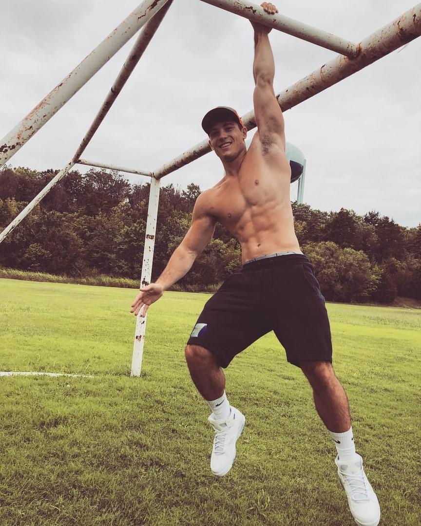 cute-shirtless-fit-guy-smiling-working-out-football-field-hunk