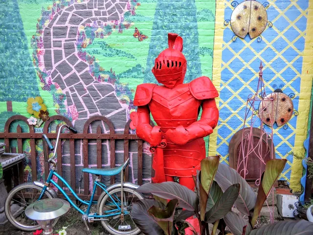 Suit of armor painted red at Randyland in the Mexican War Streets neighborhood of Pittsburgh