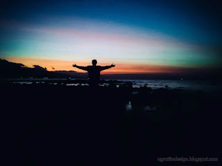 Silhouette Of Man On Tropical Rocky Beach In The Dark Evening Light At The Village Umeanyar North Bali Indonesia