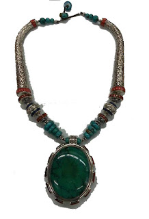 The charming handmade design is made in silver and the reddish turquoise stone makes it more attractive.
