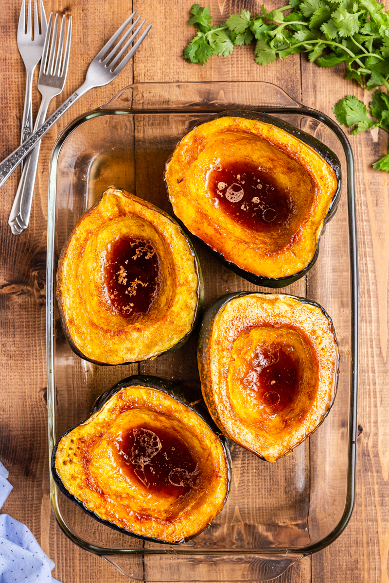 Low Carb Brown Sugar Chile Roasted Acorn Squash out of the oven in a glass dish, ready to serve.