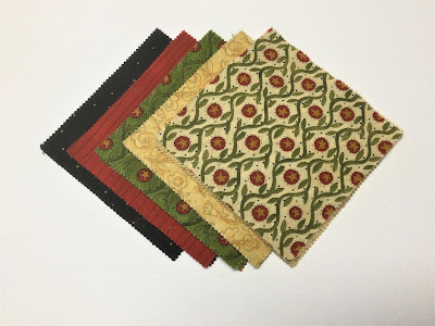 A grouping of country style five inch charm squares A co-ordinating group of five inch Charm Squares