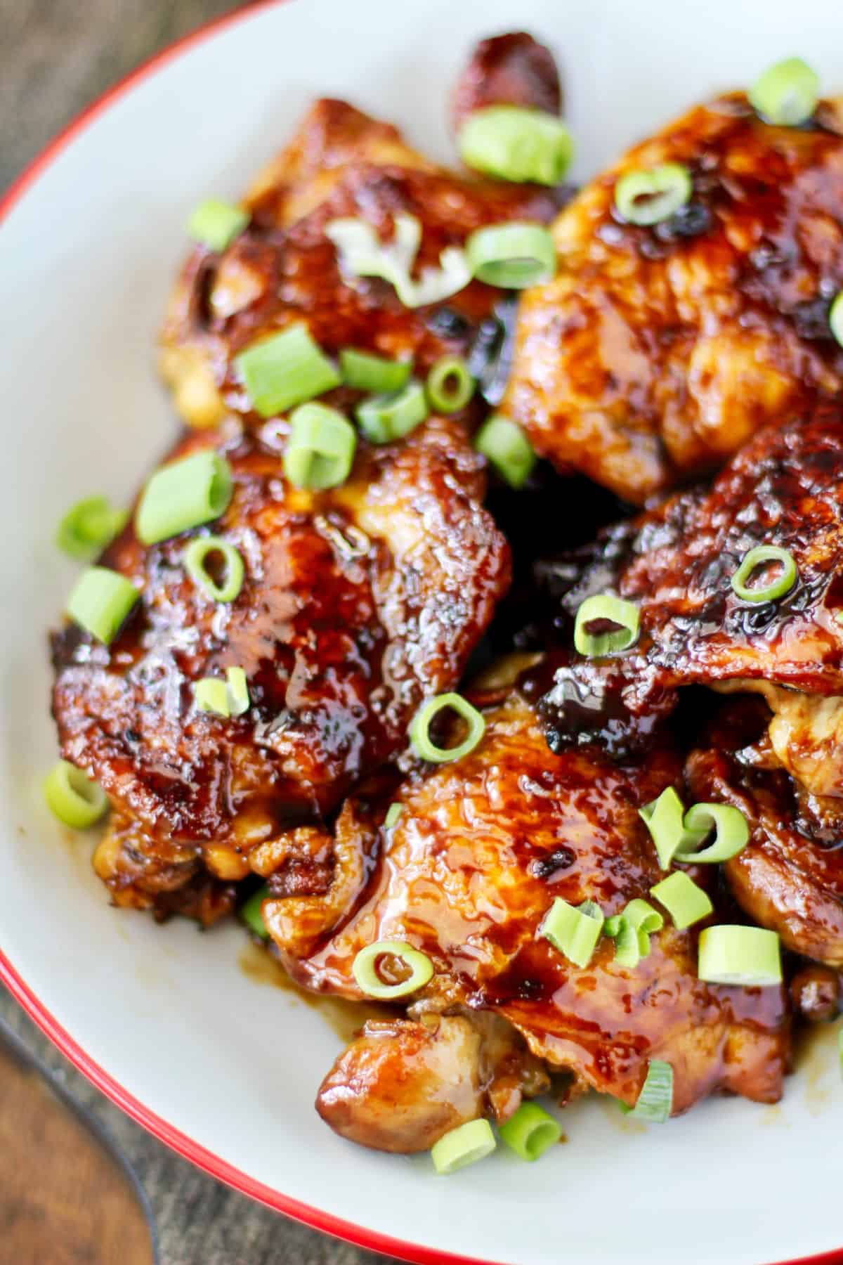 Garlic and Ginger Caramel Chicken Thighs in bowl.