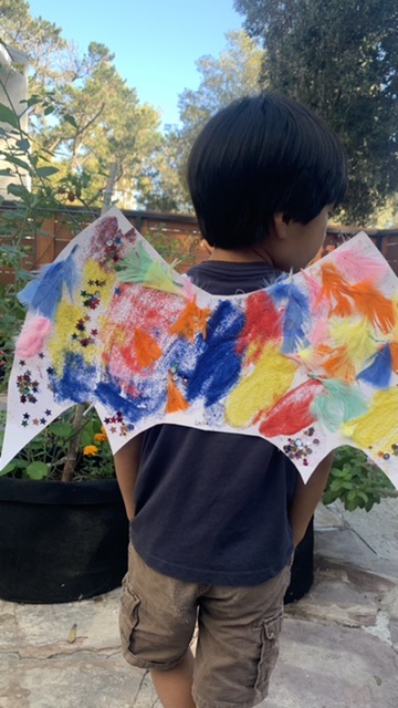 Make artsy cardboard dragon wings craft with preschoolers