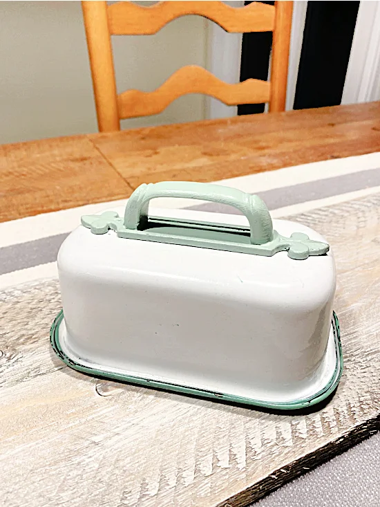 butter dish with green handle at the table