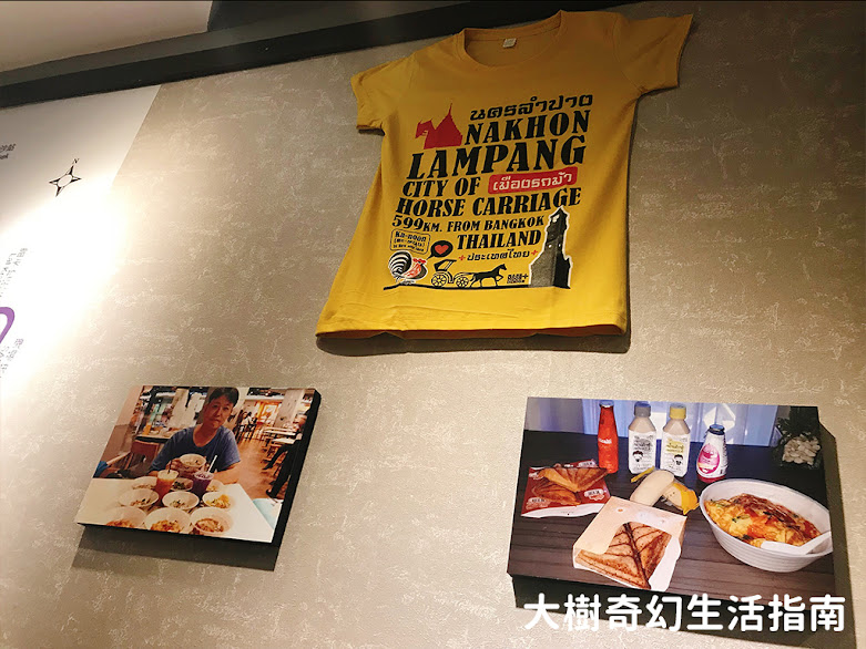 牆上有泰國T-shirt和街頭小吃照片