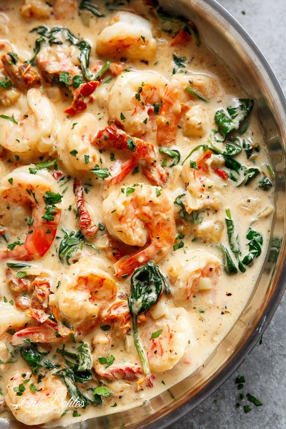Creamy Garlic Butter Tuscan Shrimp coated in a light and creamy sauce ...