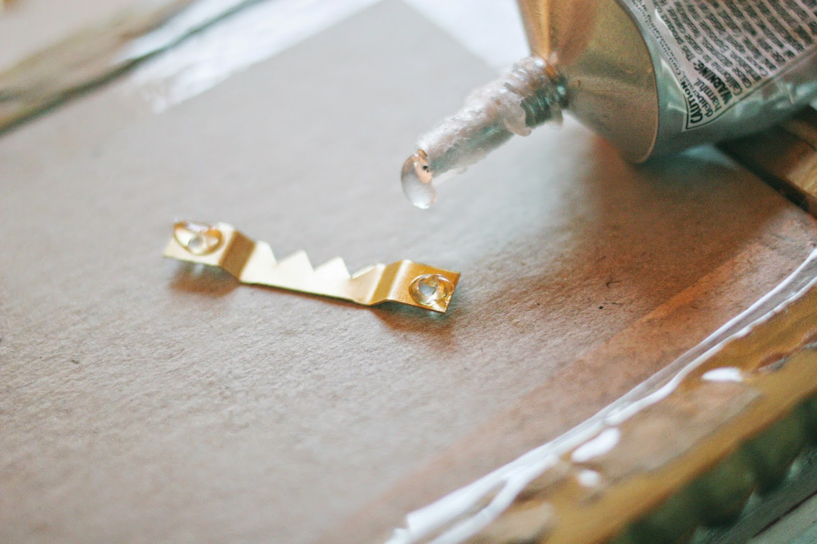 A Simple Tip // How to Attach a Picture Hanger to a Plastic or Metal