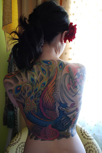 tatooed women peacock tattoo on back