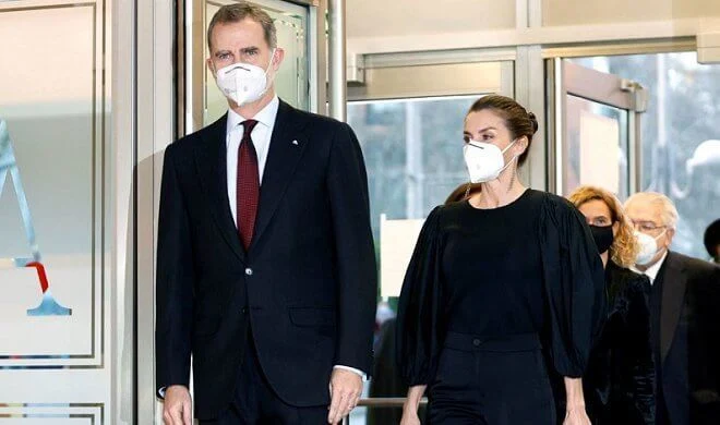 Queen Letizia wore a new black puff-sleeve taffeta knit top and trousers from Manuel Pertegaz