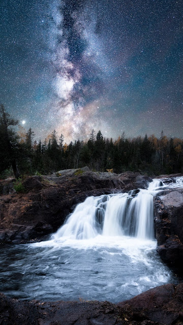 Landscape wallpaper of beautiful waterfall at night