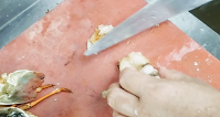 Cutting lobster tail meat for lobster hot garlic sauce recipe