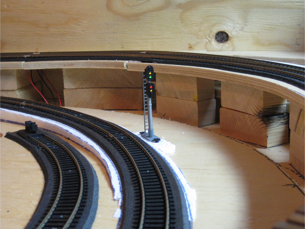 Dual trackside signal installed at the entrance to a future tunnel poral