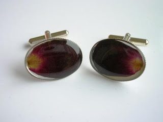 Sterling silver cufflinks containing flower petals