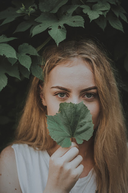 Is it better to be ignorant sometimes in life? Example of a woman with leaf.