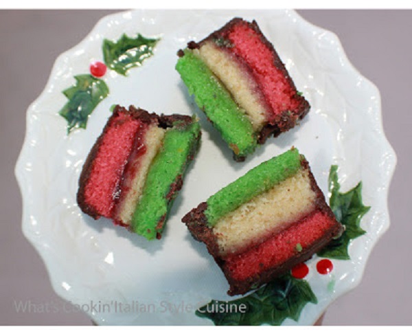 Italian Rainbow Cookie Recipe this is a triple colored cookie that looks like the rainbow in pin, green and white with chocolate melted and cut in squares