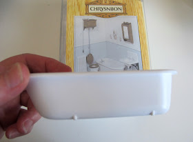 Chrysnbon dolls' house miniature bathroom furniture kit F-230, with miniature bath held up in front.