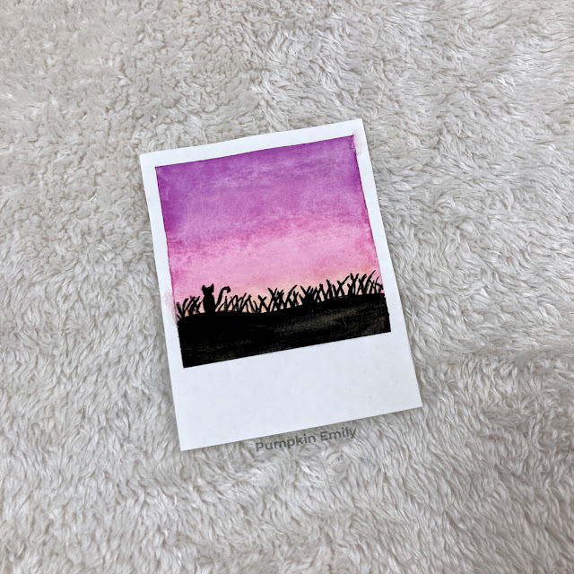 cat watching the sunset in a field watercolor polaroid painting