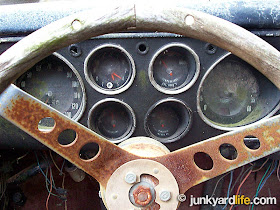 The Claymobile was built around and on a 1965 Corvair Corsa. Many parts including the 6-pod gauges were found intact on the Claymobile.