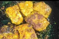 Crisp fish fry pieces on a pan or tawa