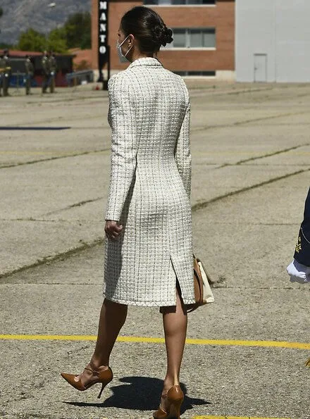 Queen Letizia wore a dress by Felipe Varela for baptism ceremony of Princess Leonor. Carolina Herrera authentic handbag
