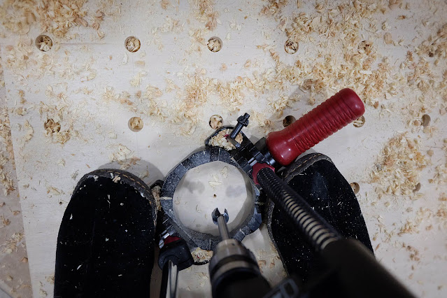 using portable drill press to drill out pegboard holes