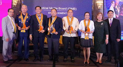 Intellectual Property Month Guest of Honors Intellectual Property Month Guest of Honors wearing orange rosette necklace lei