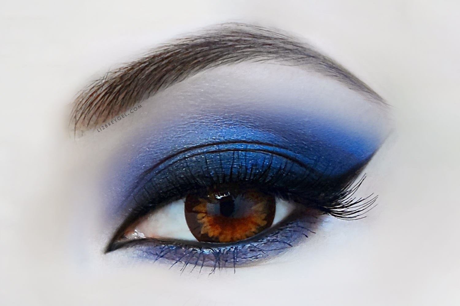 a close-up picture of an eye with dramatic makeup look