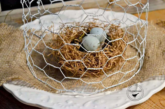 Nest with eggs on burlap covered with chicken wire