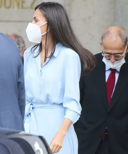 Queen Letizia wore a light blue belted shirt dress from 2019 collection of Pedro del Hierro. Carolina Herrera pumps